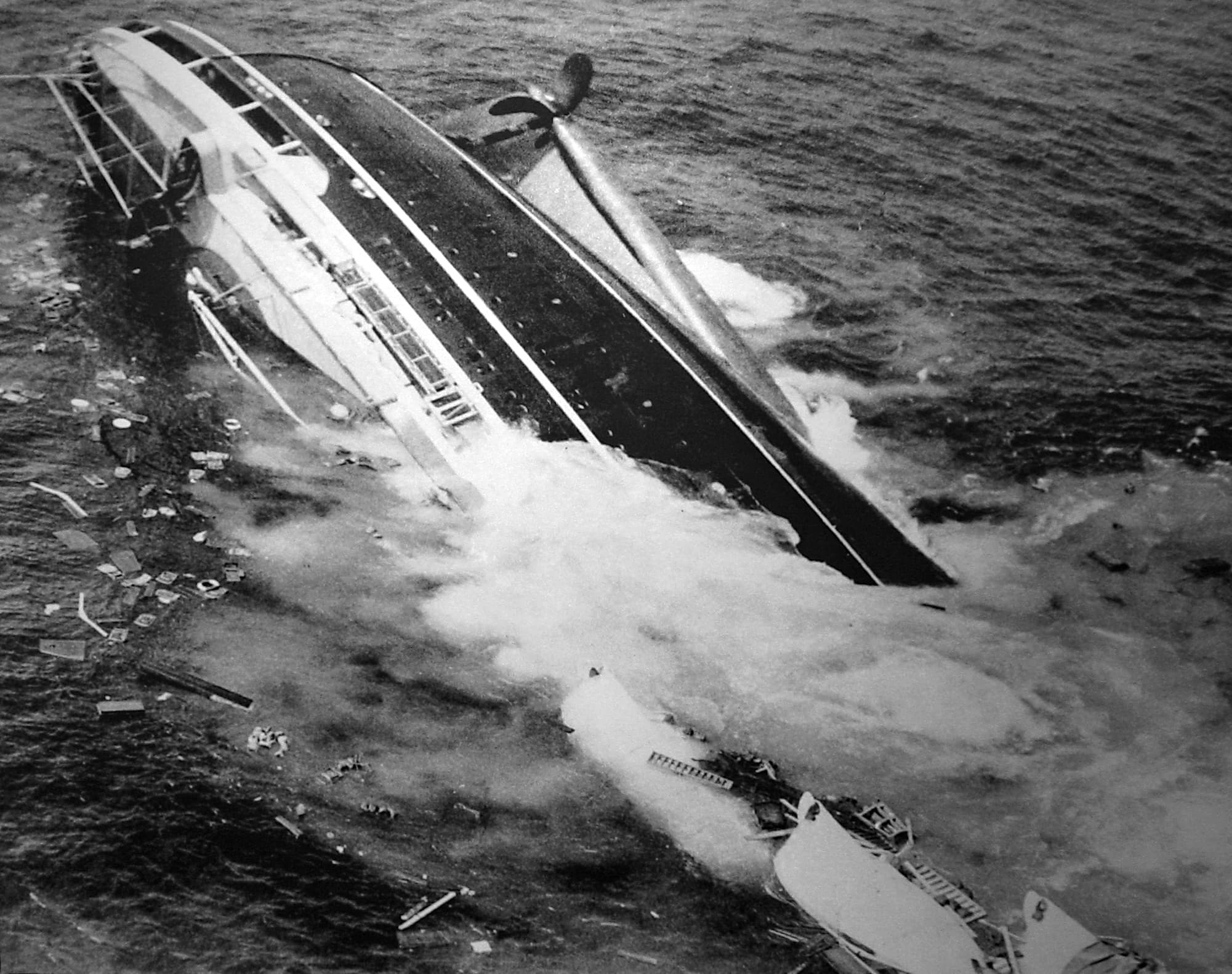 SS Andrea Doria listing and sinking after its 1956 collision.