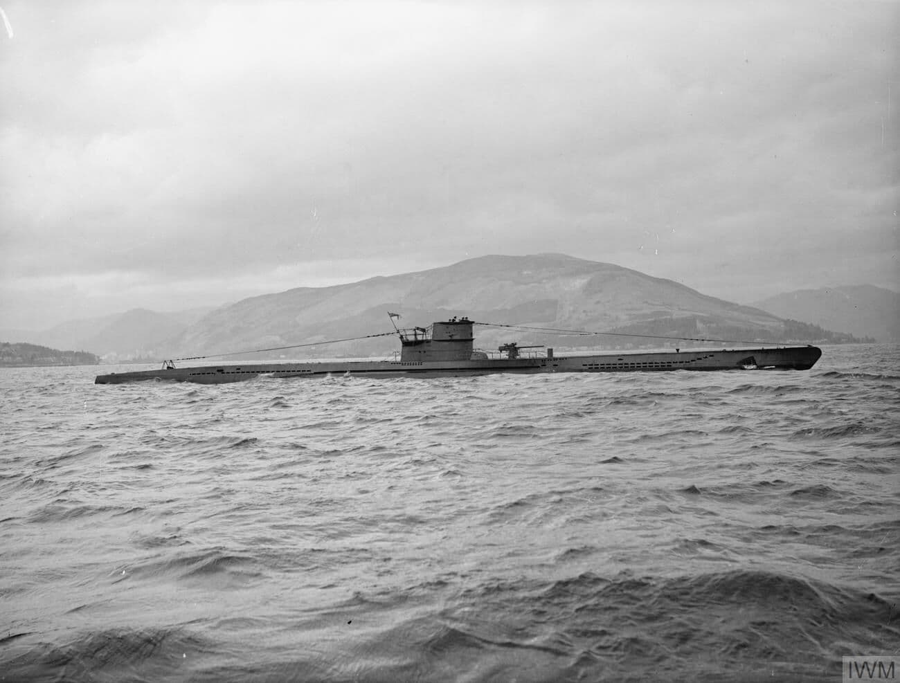 Side profile of German Type VIIC submarine U-570 at sea in 1943.